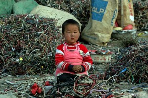 a-chinese-child-sits-amongst-landiflls